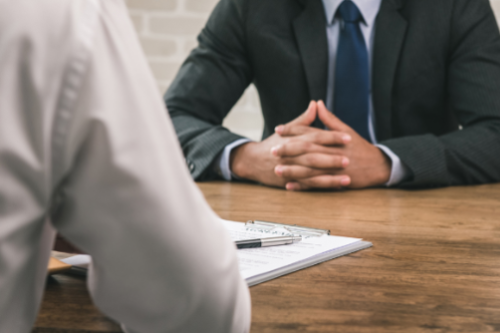 Business partner with contracts signing table
